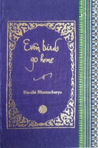 A sample cover of the book: Indigo-blue handloom sari with gold embossed nameplate and lettering for the title and author's name. The border of the sari lines the right hand margin of the cover.