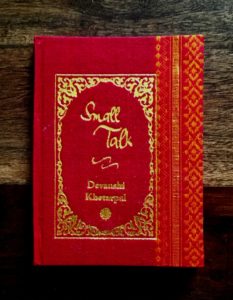 Sample cover of book. Red sari binding with trademark gold embossed title design.