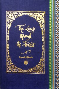 A sample cover of the book: navy blue coloured handloom sari with gold embossed nameplate and lettering for the title and author's name. The border of the sari lines the right hand margin of the cover.