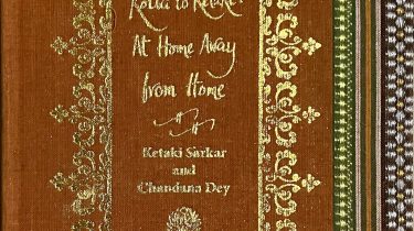A sample cover of the book: ochre coloured handloom sari with gold embossed nameplate and lettering for the title and author's name. The border of the sari lines the right hand margin of the cover.