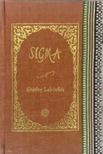 A sample cover of the book: ochre coloured handloom sari with gold embossed nameplate and lettering for the title and author's name. The border of the sari lines the right hand margin of the cover.