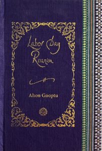A sample cover of the book: midnight blue handloom sari with gold embossed nameplate and lettering for the title and author's name. The border of the sari lines the right hand margin of the cover.