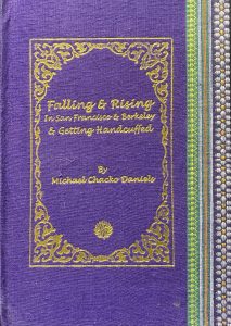 A sample cover of the book: purple handloom sari with gold embossed nameplate and lettering for the title and author's name. The border of the sari lines the right hand margin of the cover.