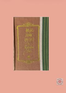 A sample cover of the book: salmon coloured handloom sari with gold embossed nameplate and lettering for the title and author's name. The border of the sari (dark green in colour) lines the right hand margin of the cover. The book is placed against a pink background.